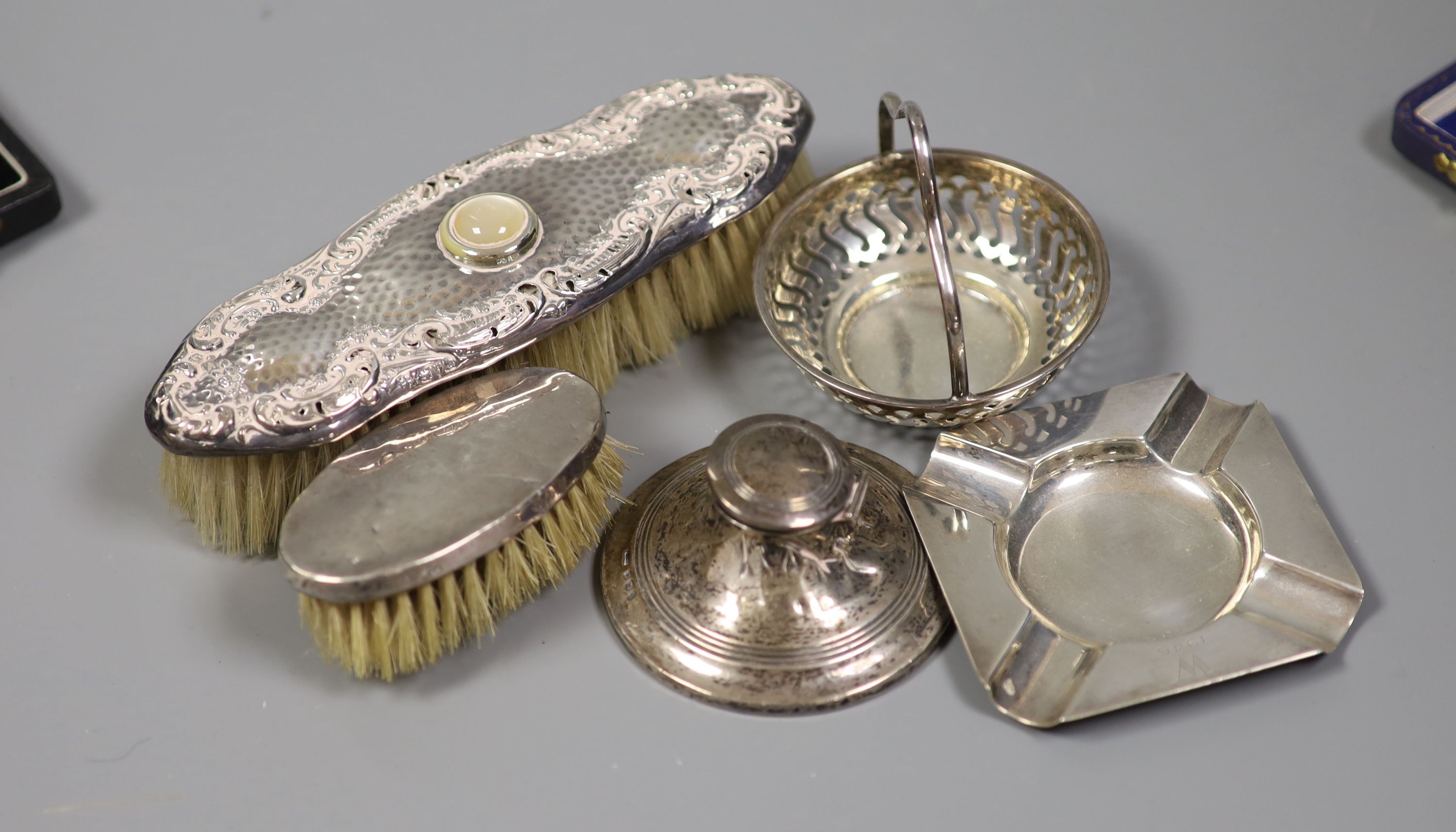 A collection of small silver including condiments, mirror and brushes, astray, cased items and a pair of sterling servers.